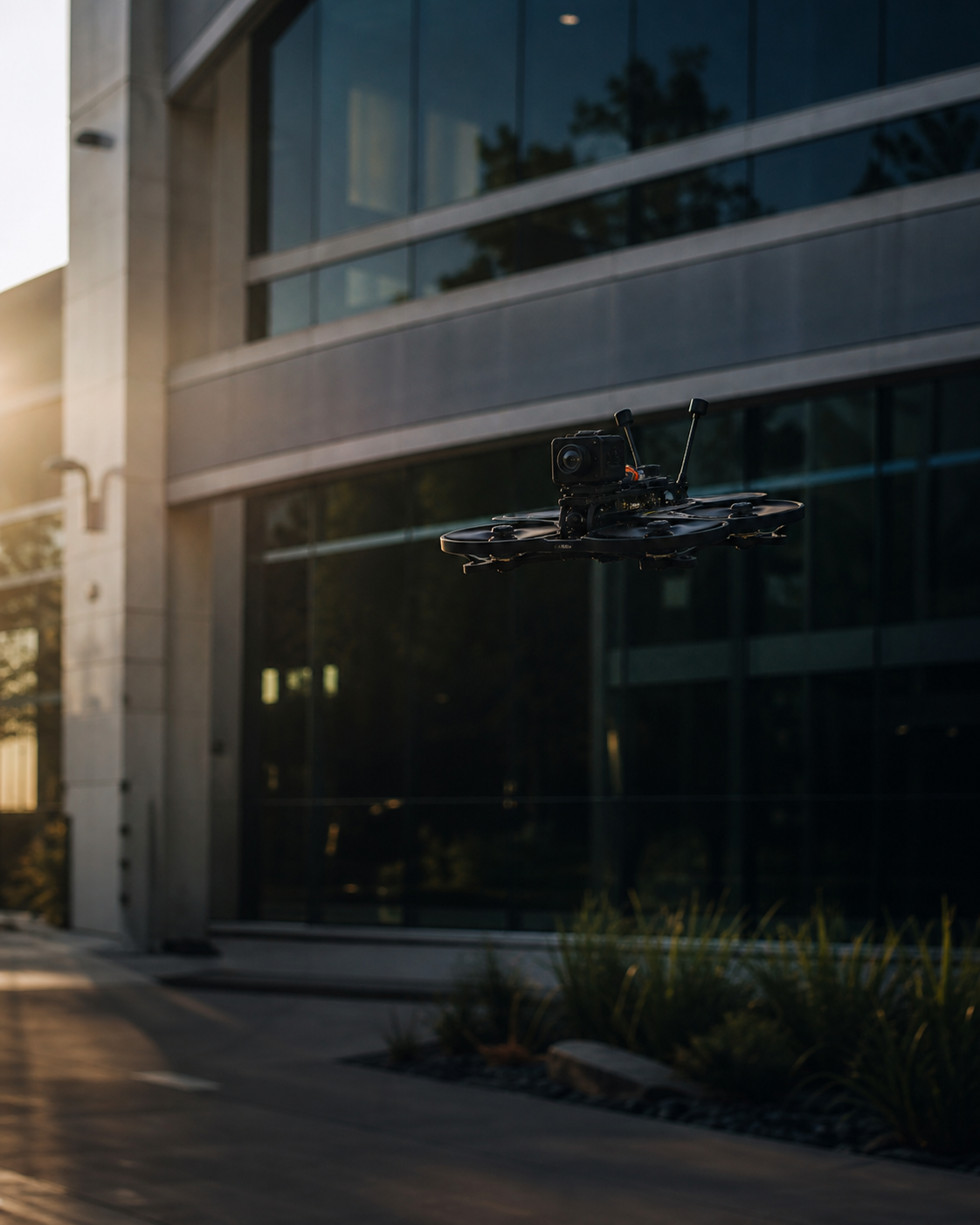 Professional FPV cinema drone filming a modern Houston-area commercial property
